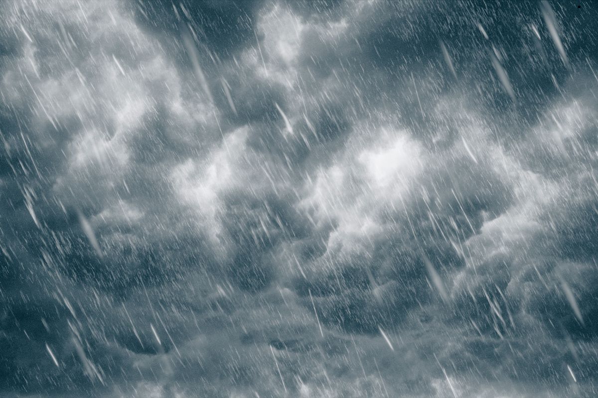 Dark storm clouds gather over the ocean, highlighting the need for window cleaning services during inclement weather.